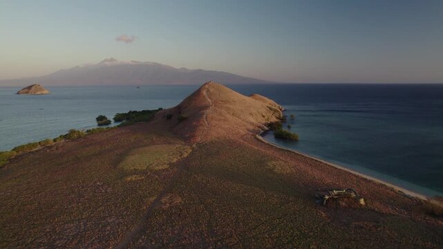 Aerial view of Kanawa Island at golden hour, Indonesia.