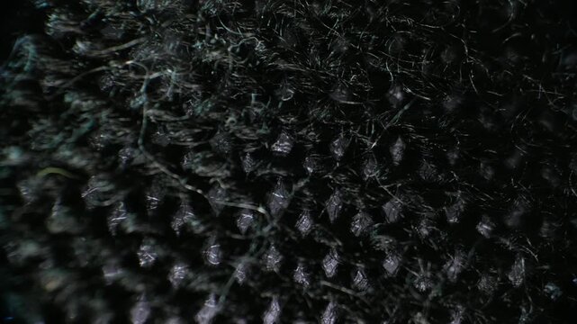 Macro close-up of dark black woven fabric texture