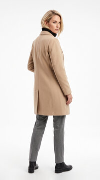 Elegant woman in beige wool coat posing over her shoulder
