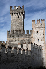 Ancient white stone castle with rectangular towers on sunny day, Sirmione, Lake Garda, Italy © Igor