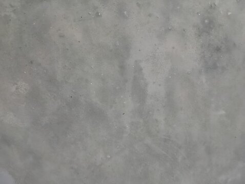 Natural unpainted wall, grunge texture, wide horizontal banner background with spacious copy space for text. Rough gray surface with chips, cracks, scratches, stains, and distressed details. 
