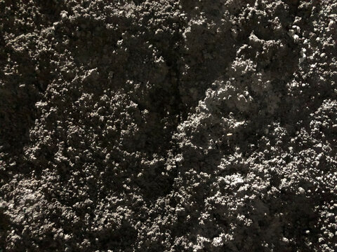 Rough grey concrete texture, macro sand cement mix surface background
