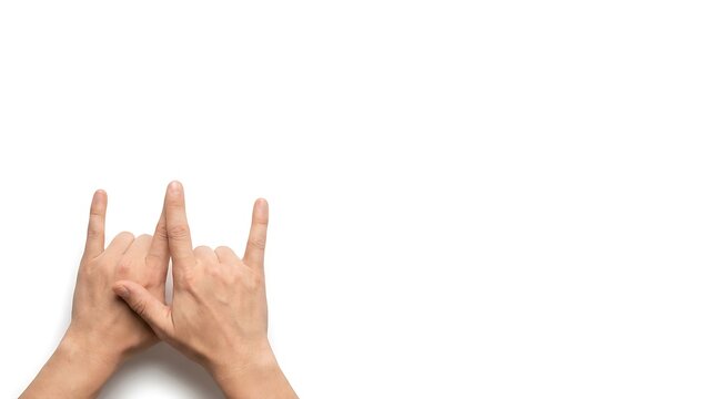 Human hands showing rock and roll sign of horns gesture isolated on pure white background with copy space