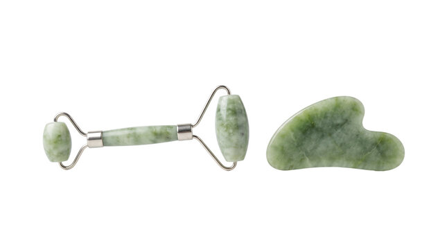Green jade facial roller and stone scraper for beauty therapy treatments
