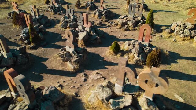 Ancient Monument of the Armenian Alphabet in Armenia, Historic Stone Letters Displayed Across a Scenic Landscape, Cultural Landmark Celebrating Armenian Language, Heritage and National History