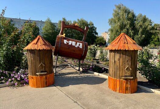 Decoration featuring beehives and a mug of honey