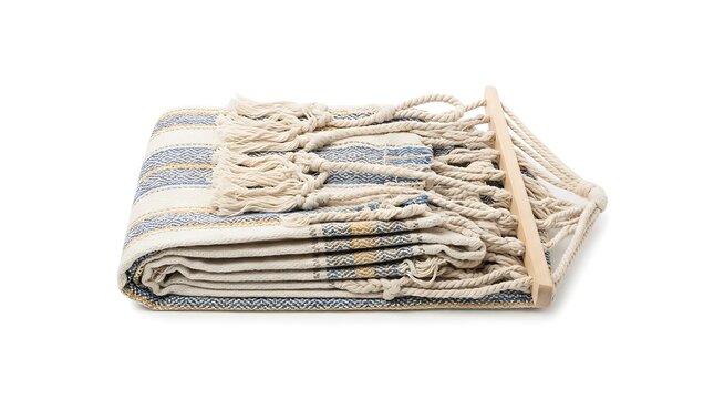 A folded woven blanket with a wooden dowel on a white background