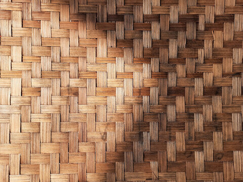 Natural bamboo strips form a woven texture with warm brown tones, creating a rustic background for crafts, interior design, packaging, wallpaper, and creative projects.