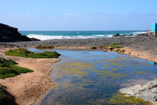 View of a stream leading out to sea, Los Molinos, Fuerteventura, Canary Islands, Spain, Europe.
