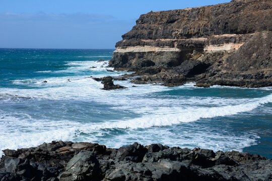 View of the rugged rocks and sea along the shoreline, Los Molinos, Fuerteventura, Canary Islands, Spain, Europe.
