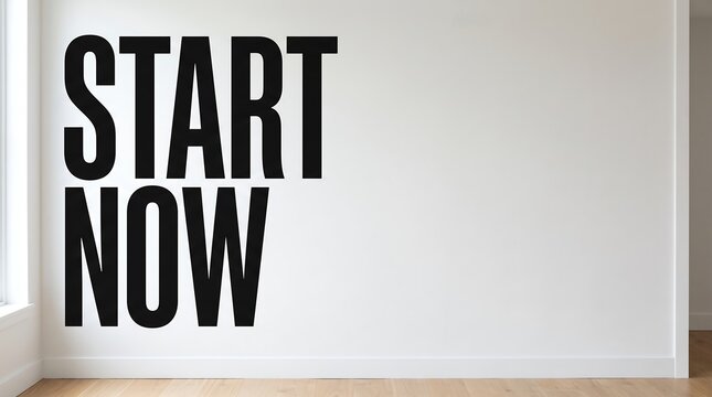Start now black typography sign on a grey wall