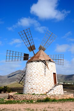 View of a traditional windmill and surrounding countryside, Tefia; Fuerteventura, Canary Islands, Spain, Europe.