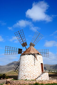 View of a traditional windmill and surrounding countryside, Tefia; Fuerteventura, Canary Islands, Spain, Europe.