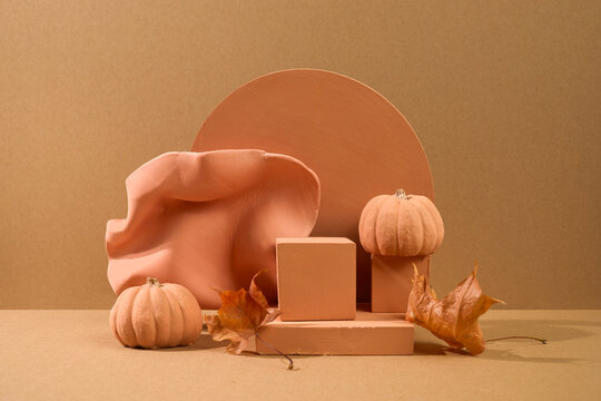 Autumn pumpkins and terracotta podiums product display
