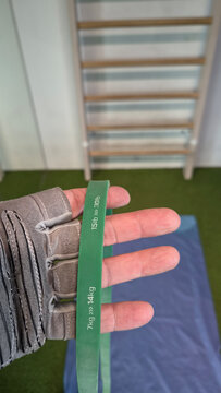Holding a green resistance band