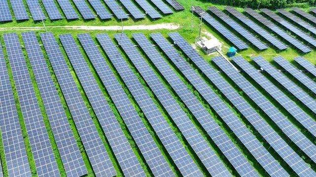 A photovoltaic panels on green land highlights modern renewable energy infrastructure designed to produce clean electricity, reduce carbon emissions and support a sustainable future economy.
