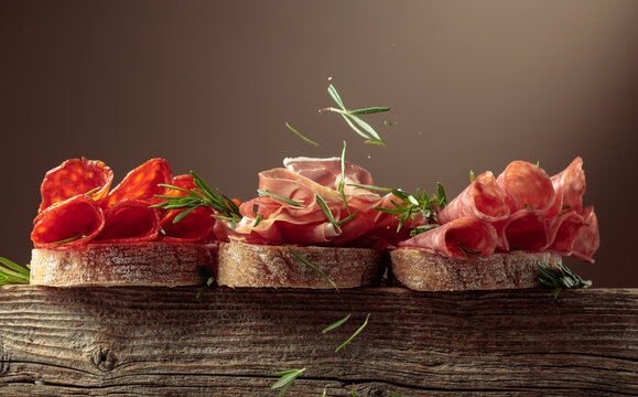 Sandwich with thin slices of Italian dry cured prosciutto, salami, and chorizo sausages.