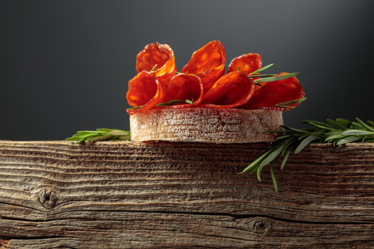 Sandwich with thin slices chorizo sausages.