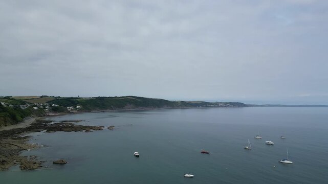 High Angle Footage of Beach and Ocean of Looe Town at River and Beach During Hot Sunny Day June 29th, 2025. Looe is a coastal town and civil parish in southeast Cornwall, England, United Kingdom.