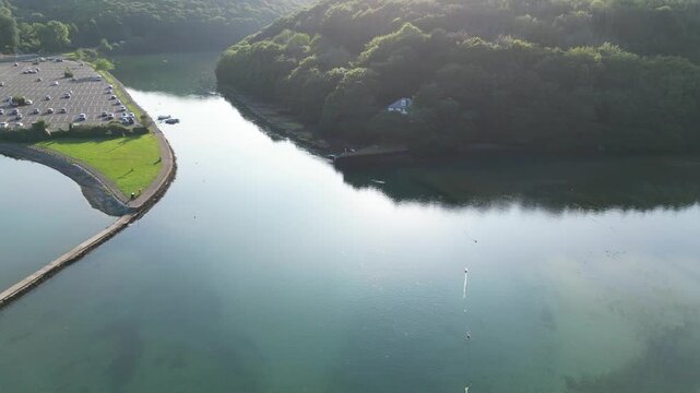 High Angle Footage of Beach and Ocean of Looe Town at River and Beach During Hot Sunny Day June 29th, 2025. Looe is a coastal town and civil parish in southeast Cornwall, England, United Kingdom.