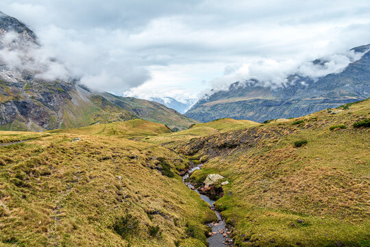 Hiking trail in Cirque de Troumouse at Heas in the Hautes-Pyrenees department in France, forming the border with Spain