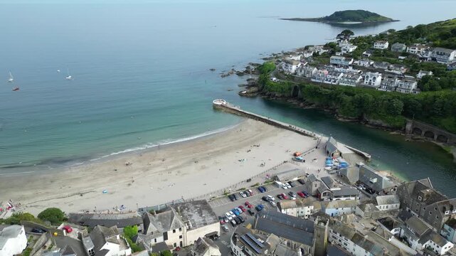 High Angle Footage of Beach and Ocean of Looe Town at River and Beach During Hot Sunny Day June 29th, 2025. Looe is a coastal town and civil parish in southeast Cornwall, England, United Kingdom.