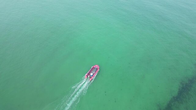 High Angle Footage of Beach and Ocean of Looe Town at River and Beach During Hot Sunny Day June 29th, 2025. Looe is a coastal town and civil parish in southeast Cornwall, England, United Kingdom.