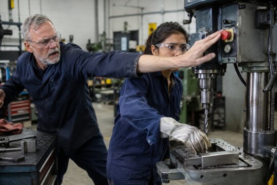 Supervisor Reaching for Emergency Stop During Drill Press Near Miss