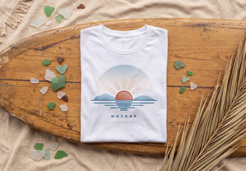 Folded T-Shirt On A Surfboard At The Beach Mockup