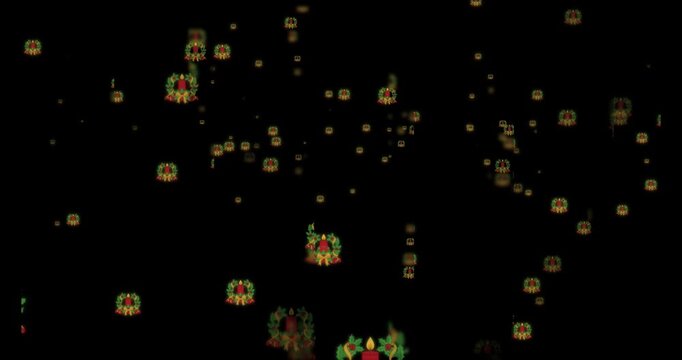 Christmas themed wreath and candle icons drifting on black background holiday seasonal decoration