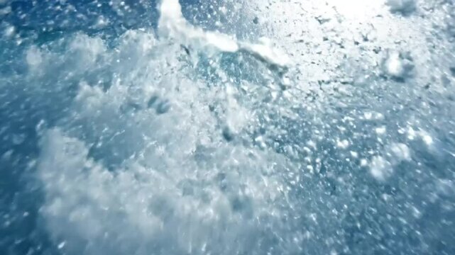 Epic ocean wave cresting with explosive spray in the bright sunlight, capturing dynamic energy and raw power