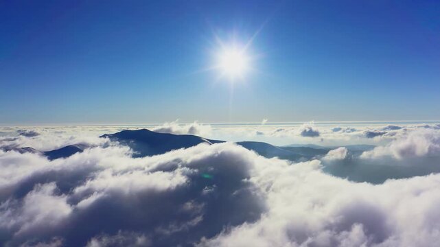 Wonderful view of extraordinary cloudy valley and bright orange sunset