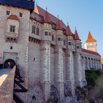 Ornate stone facade and towers of Corvin Castle in Hunedoara Transylvania Romania