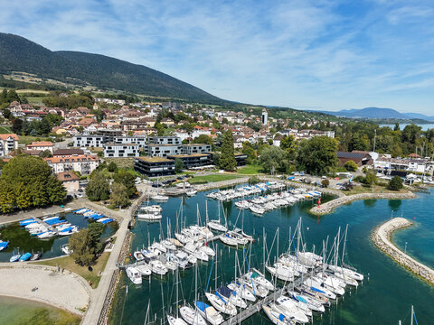 Sunny day over calm harbor with boats docked