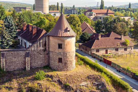 Round defensive tower and surrounding neighborhood seen from Corvin Castle in Hunedoara Romania