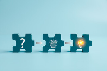 Blue puzzle pieces show a question mark, thinking head, and glowing light bulb linked by arrows, representing problem solving, creative process, critical thinking, innovation, and solutions. © Manasanan Wongchoomp