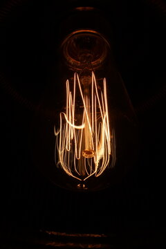 Edison bulb warm vintage lighting with dark background