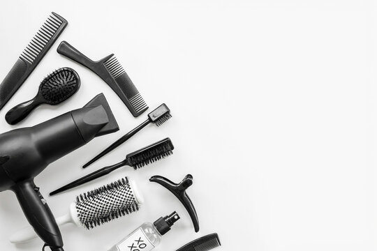 Black Hair Styling Tools Arranged on a White Background