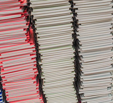 Pile of school notebooks on shelf