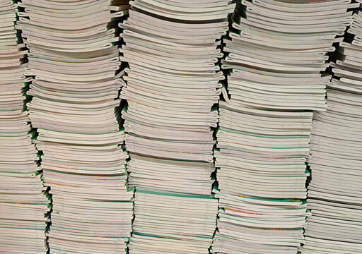 Pile of school notebooks on shelf