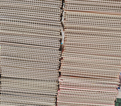 Pile of school notebooks on shelf
