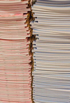 Pile of school notebooks on shelf