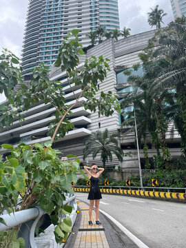 Woman exploring a modern tropical city