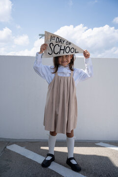 Happy Schoolgirl Celebrating Her First Day of School