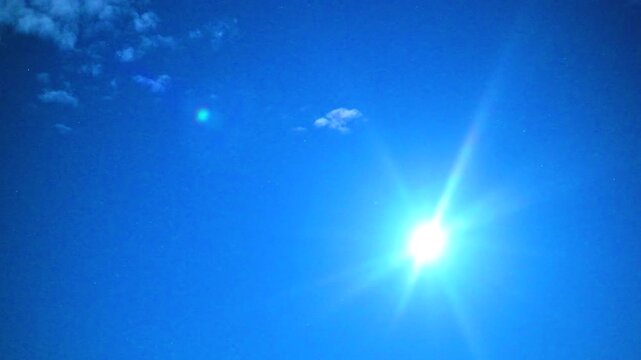 Deep Blue Night Sky and Fluffy Clouds with Tiny Twinkling Stars