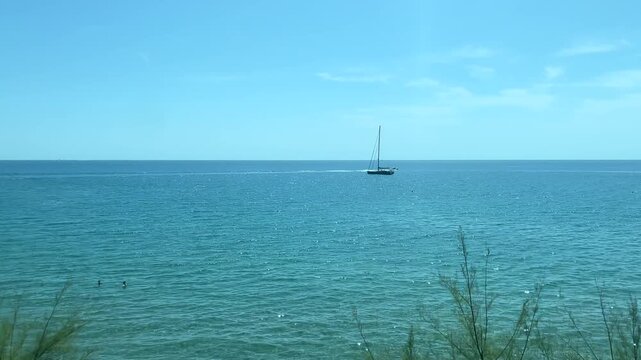View from a moving train of the Mediterranean Sea near Nice, Cote d'Azur, southern France