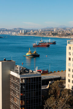 Ships anchored in coastal harbor city