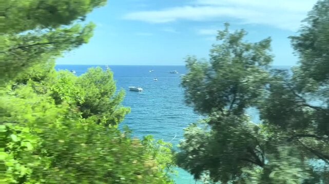 View from a moving train of the Mediterranean Sea near Nice, Cote d'Azur, southern France