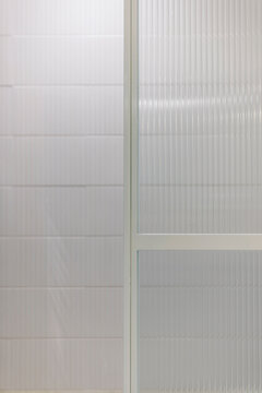 Fluted glass shower partition detail