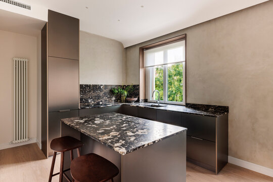 Dark marble kitchen island and counter